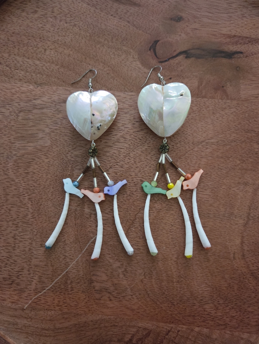 Handmade Native heart earrings with bird and flower shell details boho festival